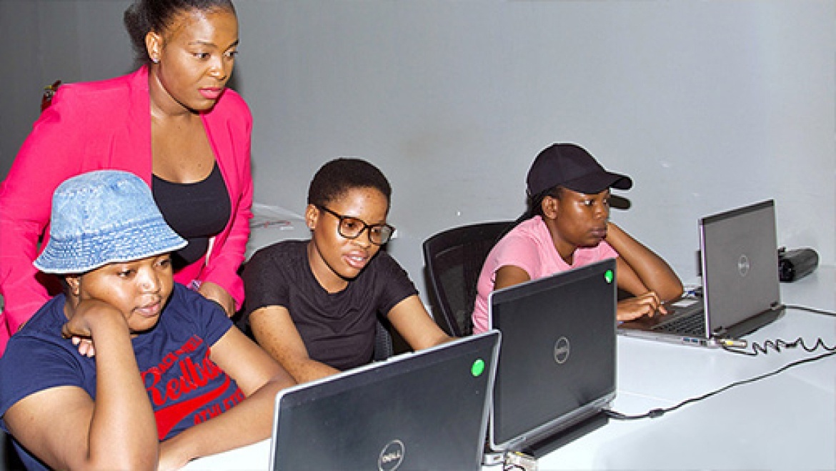 A picture of Inspired Testing training 4IR 4 HER student using laptops